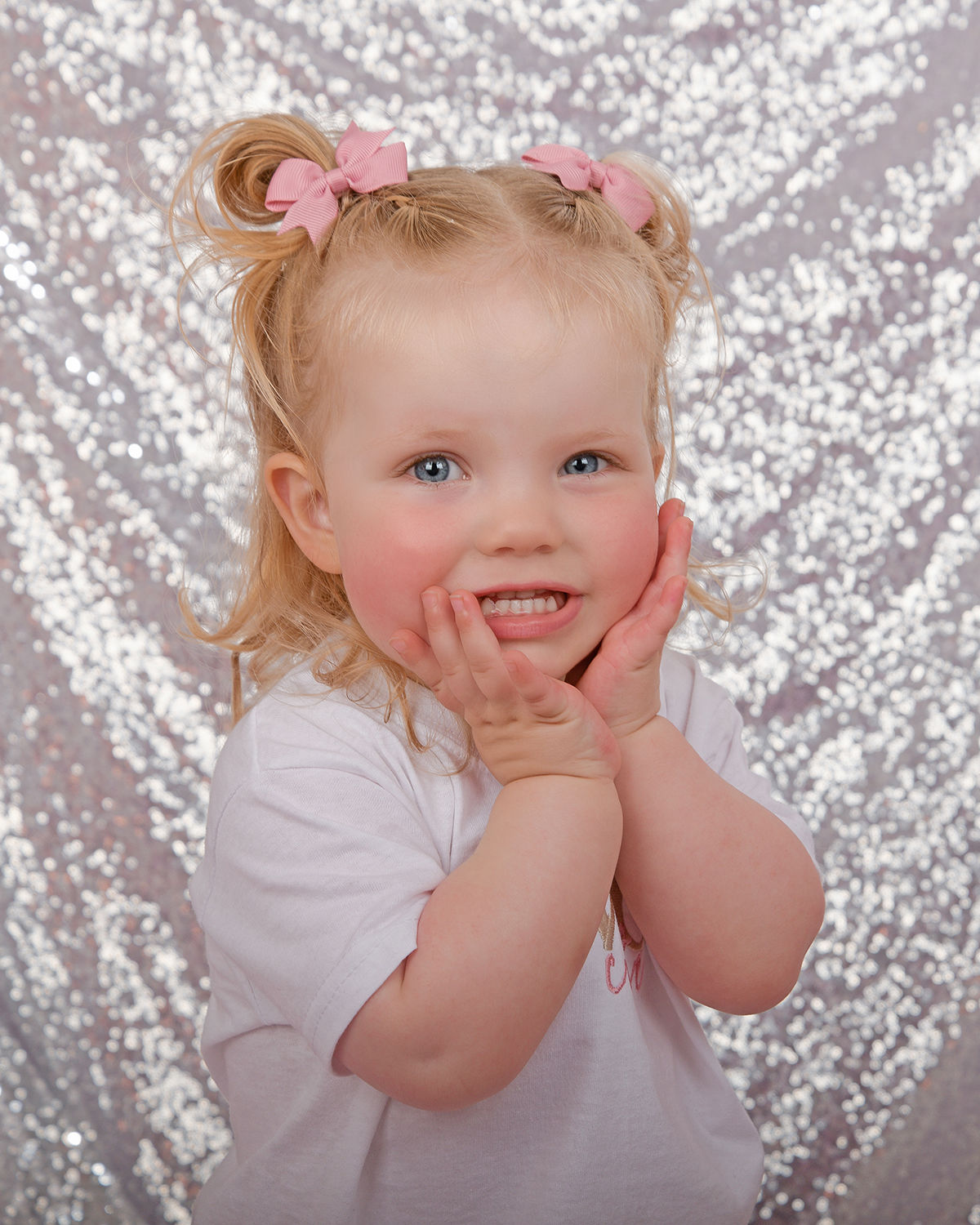 Smiling toddler in pastel